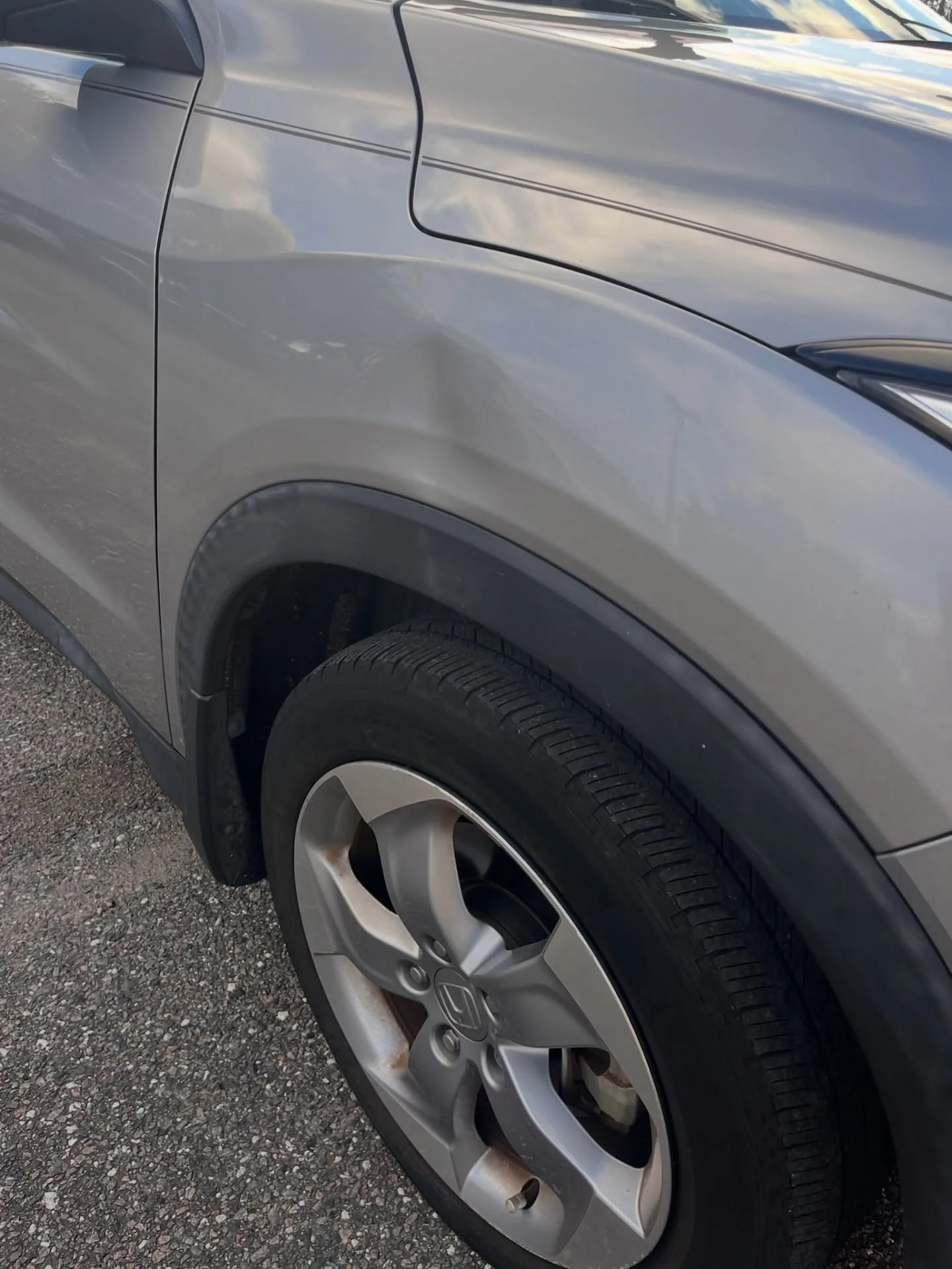 Fender dent above the wheel arch
